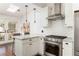 Modern kitchen featuring stainless steel appliances, granite countertops, and pendant lighting at 1012 Bellevue Ne Dr, Atlanta, GA 30306