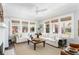 Bright living room featuring a fireplace, comfortable seating, and abundant natural light, creating a warm and inviting atmosphere at 1012 Bellevue Ne Dr, Atlanta, GA 30306