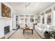 Bright living room featuring a fireplace, comfortable seating, and abundant natural light, creating a warm and inviting atmosphere at 1012 Bellevue Ne Dr, Atlanta, GA 30306