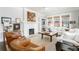 Bright living room featuring a fireplace, comfortable seating, and abundant natural light, creating a warm and inviting atmosphere at 1012 Bellevue Ne Dr, Atlanta, GA 30306