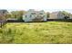 Large backyard featuring a deck and wood fence; great for outdoor activities at 186 Majesty Dr, Rockmart, GA 30153