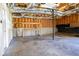 Unfinished basement with exposed ceiling, shelving, and concrete floor at 186 Majesty Dr, Rockmart, GA 30153
