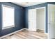 Bedroom with hardwood floors, window and closet space, featuring natural lighting at 186 Majesty Dr, Rockmart, GA 30153