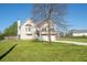 View of the charming home featuring a well-manicured lawn and a driveway leading to a two-car garage at 186 Majesty Dr, Rockmart, GA 30153