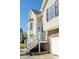 Side exterior view featuring stone accents, vinyl siding, and a bay window at 186 Majesty Dr, Rockmart, GA 30153