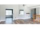 Bright living room featuring hardwood floors and a vaulted ceiling with natural light creating an inviting atmosphere at 186 Majesty Dr, Rockmart, GA 30153
