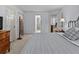 Primary bedroom with neutral walls, carpet, and views to a private bathroom and other rooms at 2407 Honey Ct, Mcdonough, GA 30252