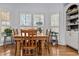 Dining room featuring wooden table and chairs with natural light at 2407 Honey Ct, Mcdonough, GA 30252