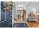 Inviting foyer with tile flooring, staircase, and decorative accents at 2407 Honey Ct, Mcdonough, GA 30252