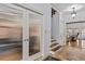 Entryway with stairs and double doors with reed glass at 2407 Honey Ct, Mcdonough, GA 30252
