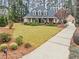 Traditional home with long driveway, and large front yard at 2407 Honey Ct, Mcdonough, GA 30252