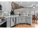 Kitchen with light grey cabinets, stainless steel appliances, and hardwood floors at 2407 Honey Ct, Mcdonough, GA 30252