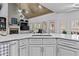 Kitchen island with white countertop, sink, and modern faucet at 2407 Honey Ct, Mcdonough, GA 30252