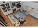Cozy living room with a fireplace, built-in shelving, hardwood floors and large windows at 2407 Honey Ct, Mcdonough, GA 30252