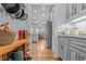Walkthrough pantry featuring gray cabinets and hardwood floors at 2407 Honey Ct, Mcdonough, GA 30252