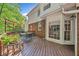 Spacious back deck with seating, a pergola, and a view of the backyard at 2885 Arborwoods Dr, Alpharetta, GA 30022
