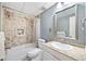 Bathroom featuring tiled shower, single sink vanity with natural light at 2885 Arborwoods Dr, Alpharetta, GA 30022