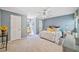Bedroom featuring light blue walls, white furniture, and natural light from the windows at 2885 Arborwoods Dr, Alpharetta, GA 30022