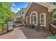 Spacious wood deck with grill and seating, perfect for outdoor entertaining in this beautiful brick home at 2885 Arborwoods Dr, Alpharetta, GA 30022
