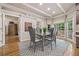 Inviting dining area featuring hardwood floors, coffered ceiling, and a view of the outdoor deck at 2885 Arborwoods Dr, Alpharetta, GA 30022