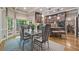 Charming dining area with hardwood floors, coffered ceiling, and kitchen view at 2885 Arborwoods Dr, Alpharetta, GA 30022