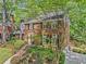 Beautiful brick home with lush landscaping, a welcoming front porch, and a private driveway at 2885 Arborwoods Dr, Alpharetta, GA 30022