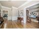 Elegant foyer showcasing hardwood floors, detailed trim, and a glimpse into the adjacent living spaces at 2885 Arborwoods Dr, Alpharetta, GA 30022
