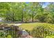 Lush front yard with mature trees and manicured landscaping, creating a serene and inviting atmosphere at 2885 Arborwoods Dr, Alpharetta, GA 30022