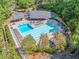 Aerial view of the community pool featuring a large swimming area, lounge chairs, and covered seating at 2885 Arborwoods Dr, Alpharetta, GA 30022