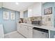 Basement wet bar with white cabinets, a mini-fridge, microwave and tiled backsplash at 2885 Arborwoods Dr, Alpharetta, GA 30022
