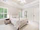 Bright bedroom with a comfortable bed and ample natural light, offering a serene and inviting space at 330 Plantation Way, Roswell, GA 30075