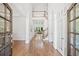Bright foyer with hardwood floors, staircase, and high ceilings leading to the living spaces at 330 Plantation Way, Roswell, GA 30075