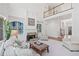 Spacious living room boasts a stone fireplace, custom built-ins, and an open floor plan with natural light at 330 Plantation Way, Roswell, GA 30075