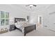 Spacious main bedroom with tray ceiling, large windows, and adjacent bathroom entrance at 330 Plantation Way, Roswell, GA 30075