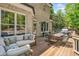 Lovely outdoor space featuring a large deck with dining and lounge seating areas at 330 Plantation Way, Roswell, GA 30075
