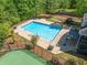 Beautiful pool and deck area, with tennis court, perfect for outdoor entertaining and relaxation at 330 Plantation Way, Roswell, GA 30075