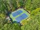 Aerial view showcases community tennis courts surrounded by lush greenery at 3585 Legacy Trce, Alpharetta, GA 30022