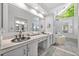 Modern bathroom features double sinks, vanity, and a tub for a spa-like experience at 3585 Legacy Trce, Alpharetta, GA 30022