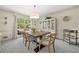 Formal dining room featuring carpet, large windows, and natural lighting at 3585 Legacy Trce, Alpharetta, GA 30022