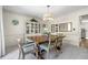 Formal dining room with elegant decor, ample seating, and display cabinet at 3585 Legacy Trce, Alpharetta, GA 30022