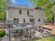 Exterior elevation view featuring the back of the house, deck and lower patio at 3585 Legacy Trce, Alpharetta, GA 30022