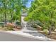 Beautiful home with a well-maintained driveway and lush landscaping at 3585 Legacy Trce, Alpharetta, GA 30022
