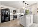 Bright kitchen with granite countertops, white cabinets, and stainless steel appliances at 3585 Legacy Trce, Alpharetta, GA 30022