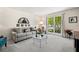 Cozy living room with comfortable seating and natural light from a large window at 3585 Legacy Trce, Alpharetta, GA 30022
