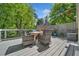 Relaxing outdoor deck area furnished with wicker chairs, a table, and scenic views at 3585 Legacy Trce, Alpharetta, GA 30022