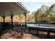 Outdoor seating area overlooks community tennis courts, providing a relaxing view at 3585 Legacy Trce, Alpharetta, GA 30022