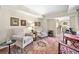 Cozy sitting area with comfortable chairs, a decorative rug, and natural light at 3585 Legacy Trce, Alpharetta, GA 30022