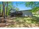 View of the home's back deck and large wooded backyard at 2022 Ramblewood Ne Ct, Marietta, GA 30062