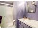 Modern bathroom featuring updated vanity, mirror, and shower with glass door at 2022 Ramblewood Ne Ct, Marietta, GA 30062