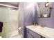 Bathroom featuring a shower with glass doors, a sink, and updated fixtures at 2022 Ramblewood Ne Ct, Marietta, GA 30062